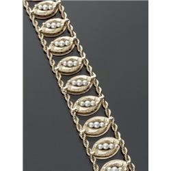 14-Karat Yellow Gold and Cultured Pearl Bracelet, Having fourteen marquis shaped links within t...