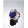 Image 1 : 14-Karat Yellow Gold Blue Sapphire and Diamond Dinner Ring, Set with one oval high cabochon sap...