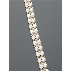 14-Karat Yellow Gold Cultured Pearl and Diamond Flexible Bracelet, Having a central row of twen...