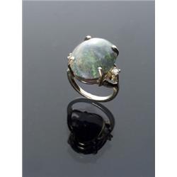 14-Karat Yellow Gold Semi-Black Opal and Twin Diamond Dinner Ring, Set with one oval cabochon o...