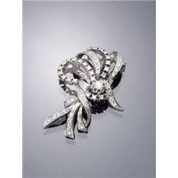 Tested 14-Karat White Gold and Diamond Floral Spray Brooch, The stamen set with one round brill...