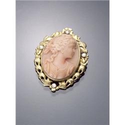 14-Karat Yellow Gold, Orange Coral Cameo and Diamond Pendant Brooch, Set with a carved high rel...