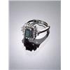 18-Karat White Gold Emerald and Diamond Dinner Ring, Set with one rectangular cut emerald weigh...