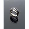 14-Karat Yellow Gold Blue Sapphire and Diamond Dinner Ring, Set with twenty-one channel set squ...