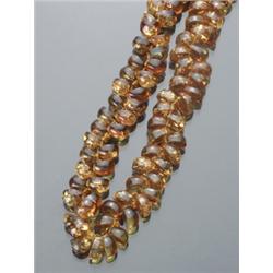 Opera Length Golden to Orangish Yellow Amber Bead Necklace, Having approximately one hundred an...