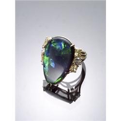 18-Karat Yellow Gold, Black Opal, Fancy Yellow and White Diamond Dinner Ring, Set with one cabo...