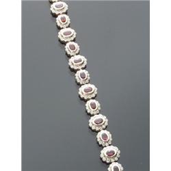 14-Karat Yellow Gold, Ruby and Diamond Flexible Bracelet, Set with sixteen oval faceted rubies...