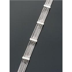 18-Karat White Gold and Diamond Bracelet, Having seven individual strands alternating with seve...