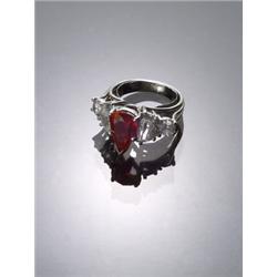 Platinum, Ruby and Diamond Dinner Ring, Set with one pear shape ruby weighing approximately 2.8...