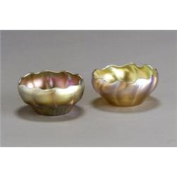 Two Tiffany Favrile Glass Bowls, 1892-1928, Each with a twisted and ribbed circular gold body...