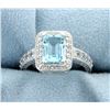 Image 1 : Halo Style Sky Blue Topaz Ring in a Vintage Style Sterling Silver  Mounting