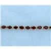 Image 1 : Garnet Bracelet with 10 carats of Gems in a Line