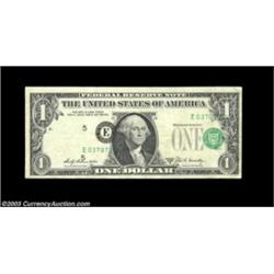 Fr. 1905-E* $1 1969B Federal Reserve Note. Very Fine. A cool circulated star error with the overprin