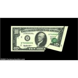 Fr. 2031-B $10 1993 Federal Reserve Note. Gem Crisp Uncirculated. A spectacular error where the pape