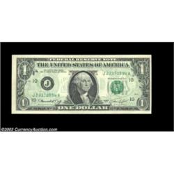 Fr. 1908-J $1 1974 Federal Reserve Note. About Uncirculated. A light back-to-front offset covers the