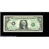 Image 1 : Fr. 1908-J $1 1974 Federal Reserve Note. About Uncirculated. A light back-to-front offset covers the