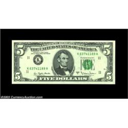 Fr. 1975-K $5 1977A Federal Reserve Note. Gem Crisp Uncirculated.A large and very dramatic ink smear