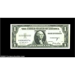Fr. 1614 $1 1935E Silver Certificate. Extremely Fine+. A very distinctive obstruction error which ha