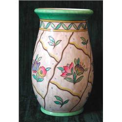 A Crown Ducal Charlotte Rhead vase of baluster form tube lined with flowers in green, pink and p...