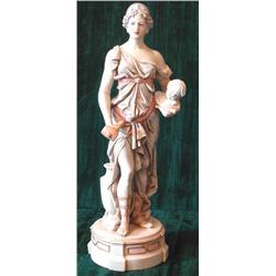 A Royal Dux porcelain figure depicting a sculptress in classical dress holding a hammer and chis...