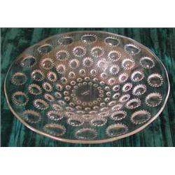 A Lalique clear glass bowl of circular form, the underside impressed with flower heads, etched R...