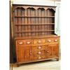 Image 1 : An early 19th century oak dresser with plate rack above three frieze drawers and three central d...