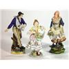 Image 1 : Two continental porcelain figures clutching…