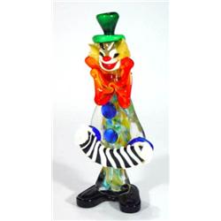 Colourful Murano glass clown playing an acc…