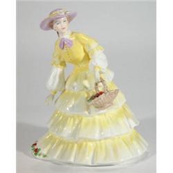 Hand painted Coalport figurine clutching a …