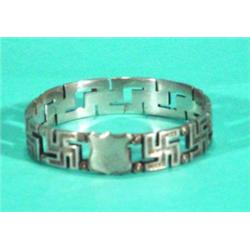 Circular silver swastika design napkin ring…