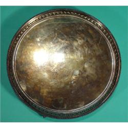 Circular silver tray on three claw and ball…