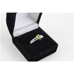 0.51CT PERIDOT AND DIAMOND SOLITAIRE RING, OVAL CUT, 2 DIAMONDS, STERLING SILVER, RETAIL VALUE $300