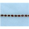 Image 1 : Garnet Bracelet with 10 carats of Gems in a Line