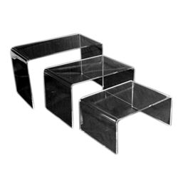 Clear 3 Piece Acrylic Riser Set.  Pieces Measure:  2 3/4 X 2" X 1 1/4" H,  3 1/4" X 2" X 1 3/4"H,  3