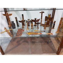 Shelf of 19 Native Carved Totems and Paddles