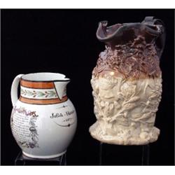An English pearlware jug, dated 1807, of ovoid form, the neck decorated with a band of flowering...