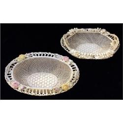 A Belleek lily flowered basket, 1921-1954, four strand, of oval form with scrolling handles and a...
