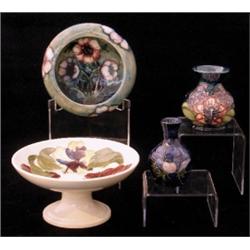 A Moorcroft dish, of flattened ovoid form, in the Anenome pattern with a central spray and the si...