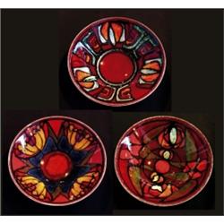 A Poole pottery dish, 1960's of shallow circular form, decorated with an abstract design in jade,...