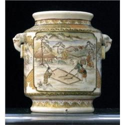 A Japanese Satsuma vase, late 19th Century, of footed cylindrical form, painted with two square p...