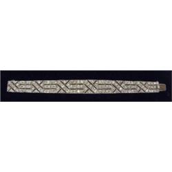 An Art Deco style panel bracelet, of geometric design, the alternate panels set with brilliant cu...