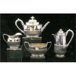 A Victorian four piece silver tea service, in the Regency style with reeded finials, covers, spou...