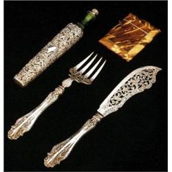 A silver mounted Edward VIII green glass scent bottle and stopper, the mounts chased and pierced...