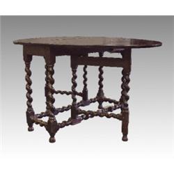 An oak gateleg table, late 18th Century, the oval top raised on barley twist and block legs and s...