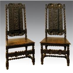 A pair of Carolean oak high backed side chairs, circa 1690, the rosette carved top rail above a b...