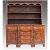 Image 1 : An oak and mahogany Welsh dresser, early 19th Century, the moulded cornice above an enclosed plat...