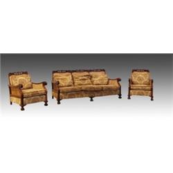 An Edwardian single caned Bergere suite, the mahogany frames with foliate carved and pierced top...