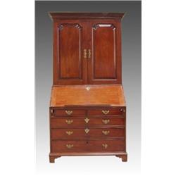 A George III mahogany bureau cabinet, circa 1790, the moulded cornice above a pair of panelled do...