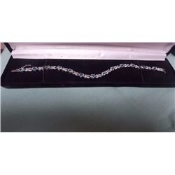 BRACELET - 12 OVAL FACETTED BLUE TOPAZ AND DIAMONDS IN STERLING SILVER SETTING - INFINITY LINKS - AP