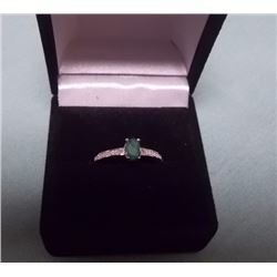 RING - .52CT OVAL FACETTED GREEN EMERALD AND DIAMONDS IN STERLING SILVER SETTING - INCLUDES CERTIFIC